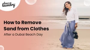 remove sand from clothes